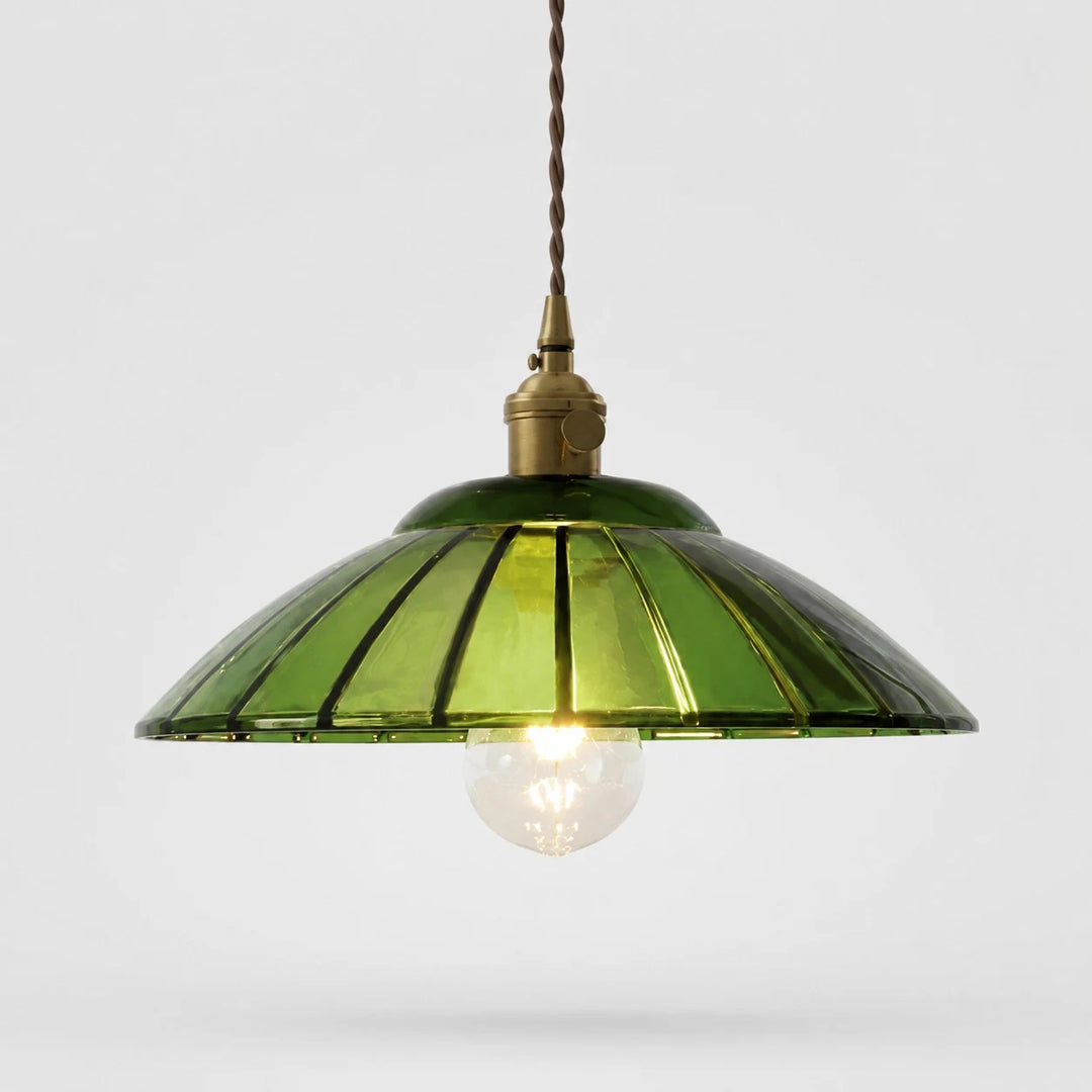Green glass pendant light on white background