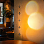 Cargar imagen en el visor de la Galería, Five head projection floor lamp in a moody bar setting