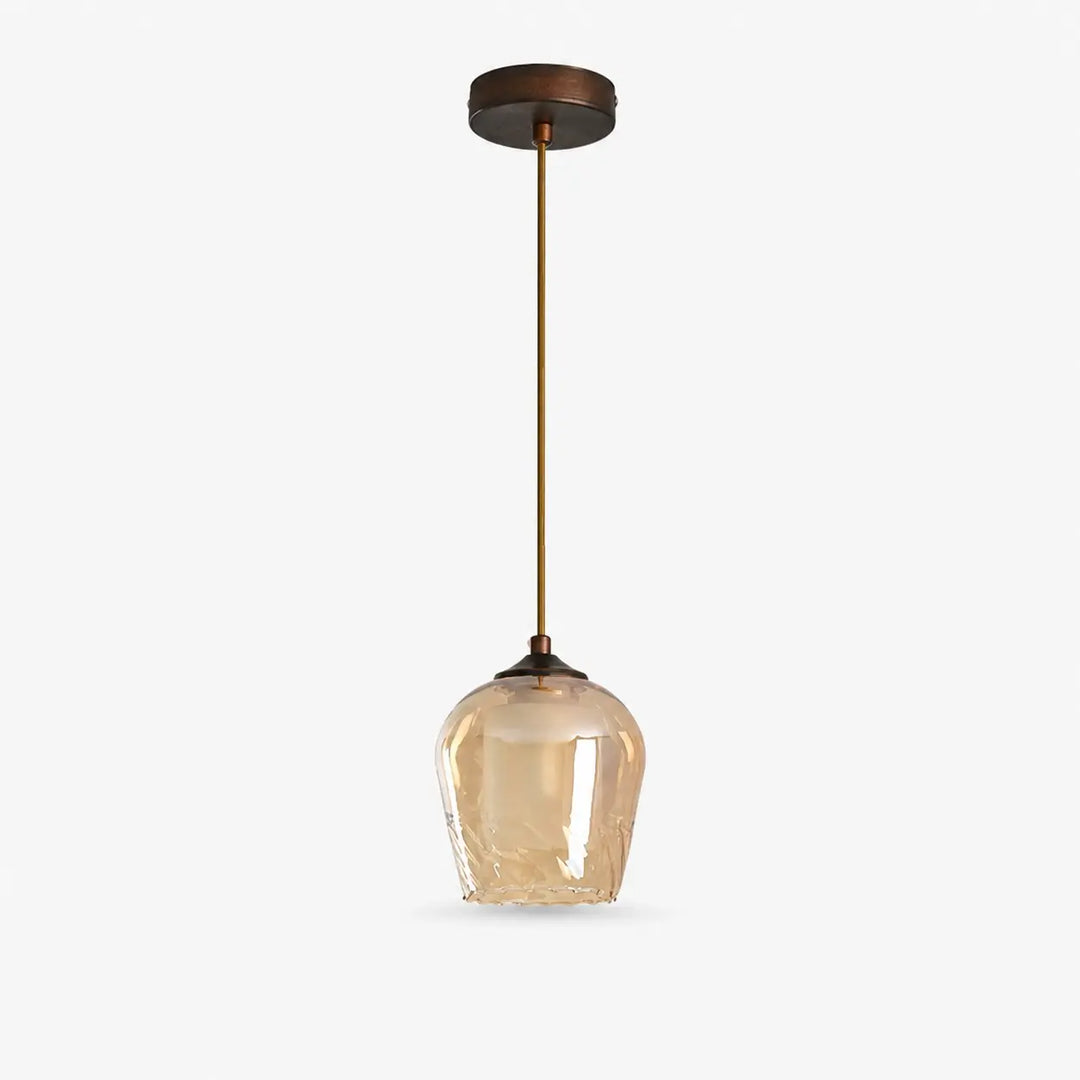 Amber glass pendant light with antique brass-tone fixture