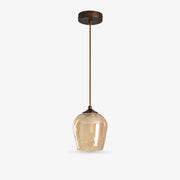 Amber glass pendant light with antique brass-tone fixture