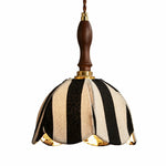 Charger l'image dans la visionneuse de galerie, Black and ivory striped fabric pendant lamp with warm light on