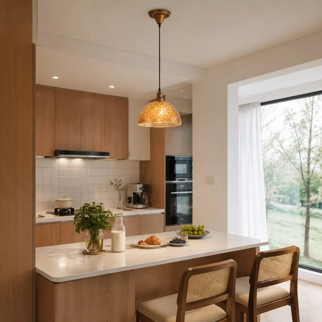 Amber pendant light over a kitchen island